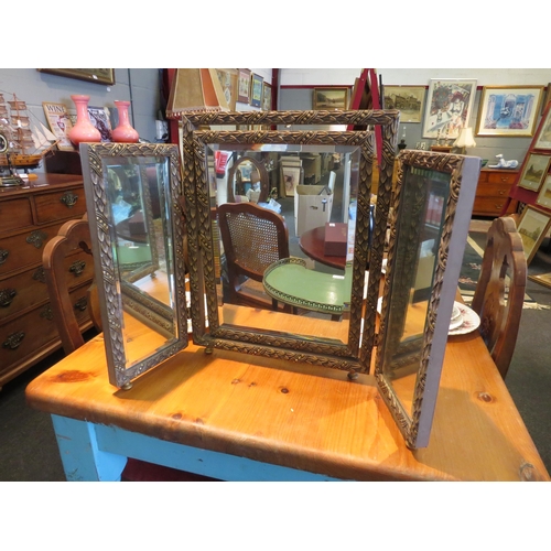 1109 - A carved brassed effect triptych free-standing mirror and a green painted three tier table with a br... 