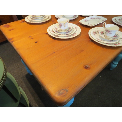 1111 - A pine kitchen table with blue painted base, 78cm high x 120cm long x 90cm wide