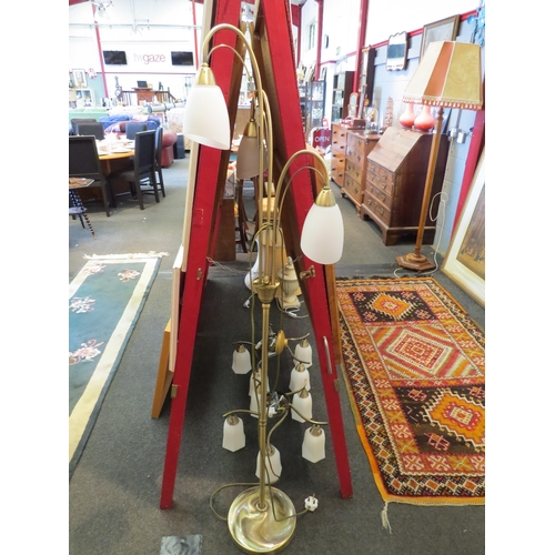 1124 - A modern brass effect standard lamp with three sconces and a pair of similar five arm ceiling lights... 