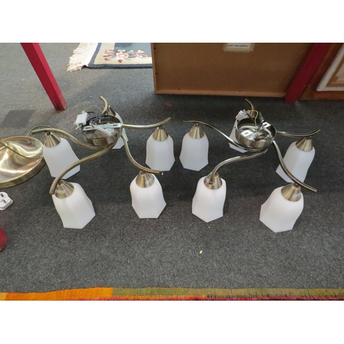 1124 - A modern brass effect standard lamp with three sconces and a pair of similar five arm ceiling lights... 