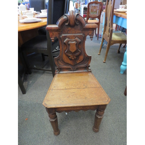 1145 - An oak hall chair, H 88cm, W(front) 43cm, W(back) 32.5cm, D 37cm