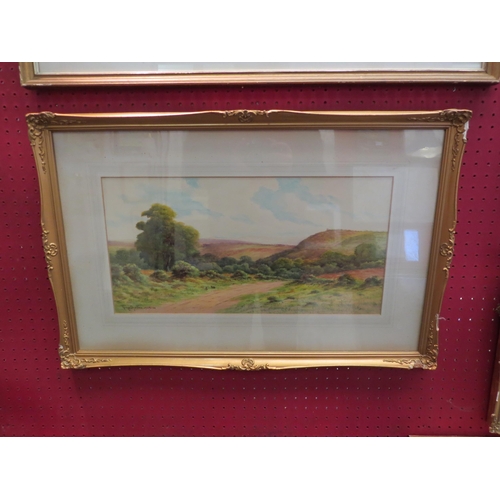 1155 - GEORGE OYSTON (1861-1937): Country lane through rolling hills, watercolour, gilt framed and glazed, ... 