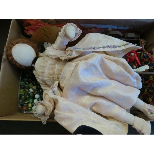 1264 - A box containing marbles, doll, Christmas decorations etc.