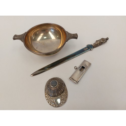 1361 - A collection of silver; a jockey cap, letter opener, quaiche bowl, cigarette cutter, 175g