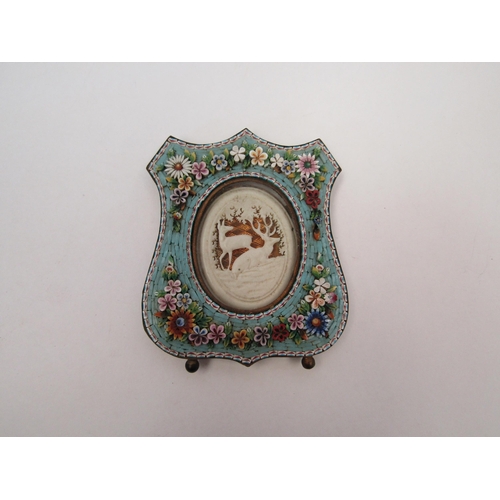 1363 - A micro-mosaic floral decorated photograph frame with bone carved central panel depicting deer in wo... 