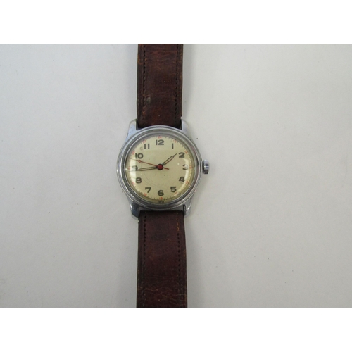 1370 - A mid to late 20th Century vintage Swiss wristwatch with Arabic numerals, face scratched, leather st... 