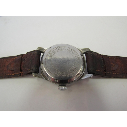 1370 - A mid to late 20th Century vintage Swiss wristwatch with Arabic numerals, face scratched, leather st... 