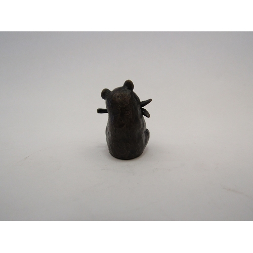 1388 - A miniature solid bronze Panda eating bamboo, boxed, 2.7cm tall