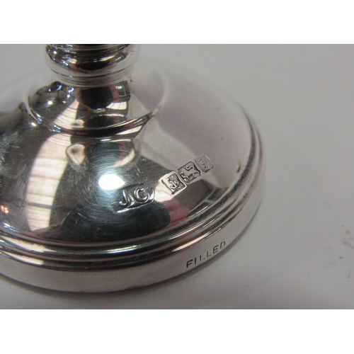 1411 - A pair of small silver weighted candlesticks together with a silver handled shoe horn and plated tra... 