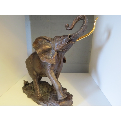 1301 - A Franklin Mint 'Giant of the Serengeti' bronzed sculpture of an elephant, African Wildlife Foundati... 