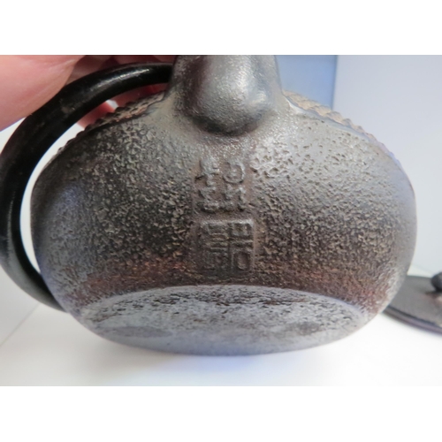 1321 - An Eastern cast iron teapot with character marks below spout