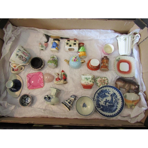 1593 - Three boxes containing crested wares including hen and pig, miniature ceramics etc.