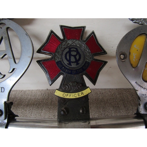 5071 - A chromed car badge rail with three attached badges No 94853D and another, also an enamelled 'Order ... 