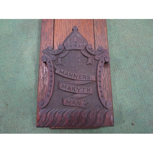 4013 - A Victorian carved oak book rack with the inscription 