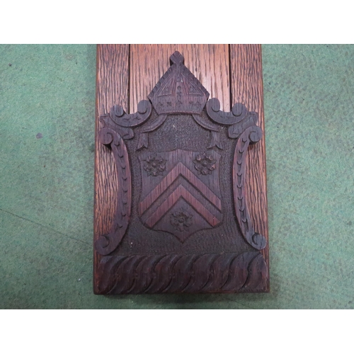 4013 - A Victorian carved oak book rack with the inscription 