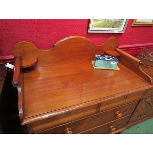 4037 - A mid Victorian mahogany chest of two short over two long drawers, the scroll end three quarter rais... 