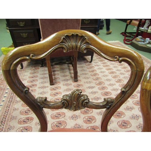 4072 - A set of four early Victorian carved rosewood chairs the serpentine front seat over cabriole fore le... 