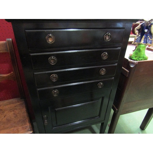 4095 - Circa 1900 an ebonised music cabinet the raised back over four drawers with drop-down fronts over a ... 