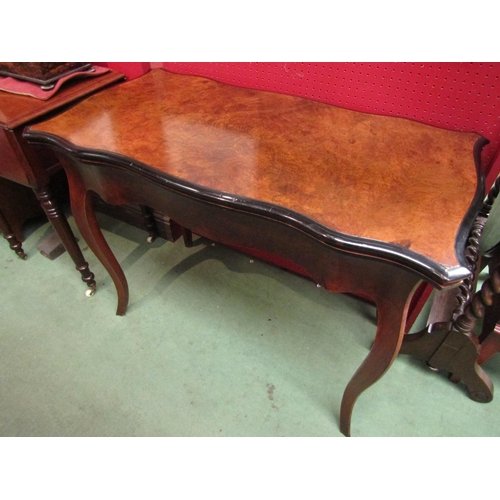 4117 - An early Victorian burr walnut serpentine shape hinged top card table the baize top with ebonised ed... 