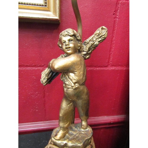 4154 - A gilt metal table lamp of Dutch boy ('Retour Du Bois Par Rancoulet') to base Ernest Rancoulet 1870-... 