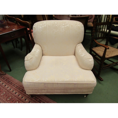 4176 - A pair of modern Howard Style upholstered armchairs of deep proportions with turned front legs and b... 