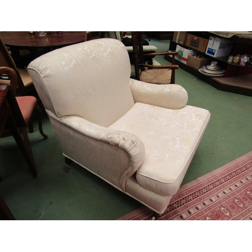 4176 - A pair of modern Howard Style upholstered armchairs of deep proportions with turned front legs and b... 