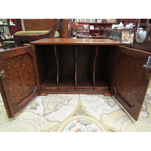 4214 - An Art Deco oak table top stationery cupboard the two doors opening to reveal a four section interio... 