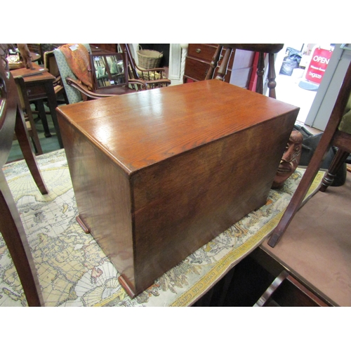 4214 - An Art Deco oak table top stationery cupboard the two doors opening to reveal a four section interio... 