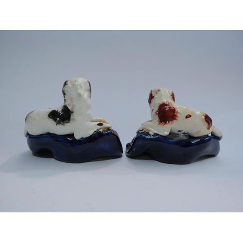 4411 - A pair of early Victorian Staffordshire dog pen holders, a/f