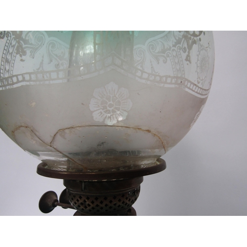 5063 - A decorative brass and blue glass oil lamp, globe repaired   (E) £10-15