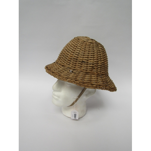 5064 - A cane pith helmet