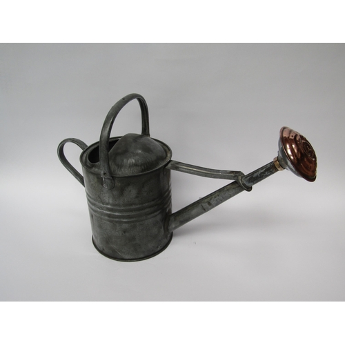 5065 - A garden watering can with polished copper rose