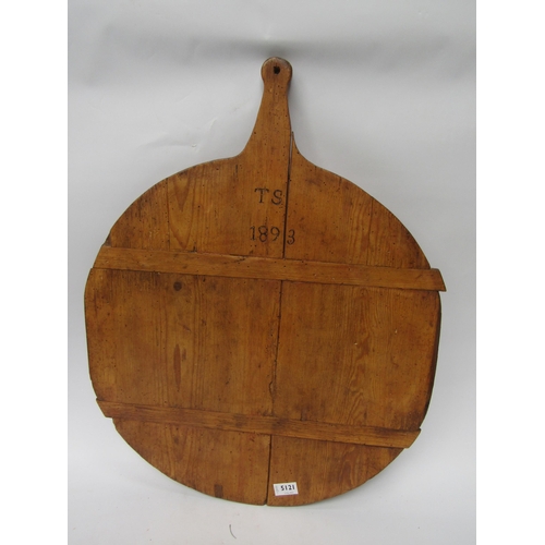 5121 - A large cheese truckle/cutting board initialled T.S and dated 1893