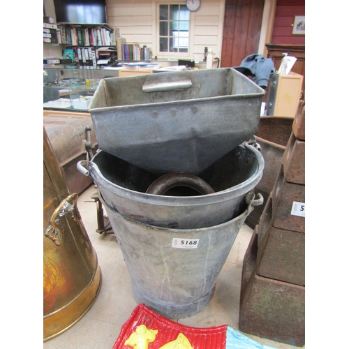 Two galvanised buckets and three funnels