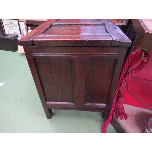 4004 - An 18th Century pegged oak three panel coffer, the ring pin hinged lid over stile feet with whorl sp... 