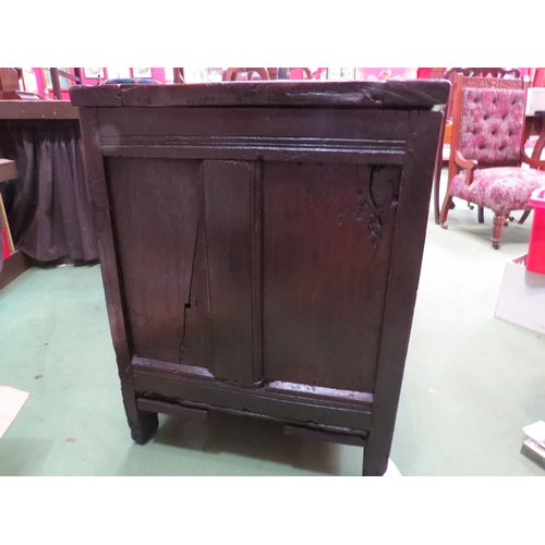 4004 - An 18th Century pegged oak three panel coffer, the ring pin hinged lid over stile feet with whorl sp... 