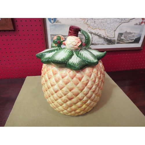 4042 - A ceramic biscuit barrel in the form of a pineapple, 14cm tall