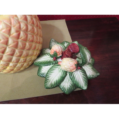 4042 - A ceramic biscuit barrel in the form of a pineapple, 14cm tall