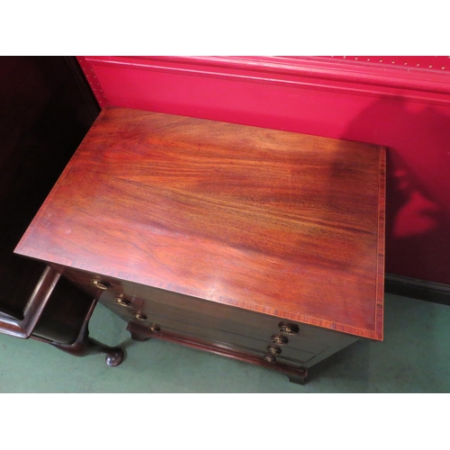 4089 - A Georgian style crossbanded mahogany chest of small proportions, the four long drawers over outswep... 