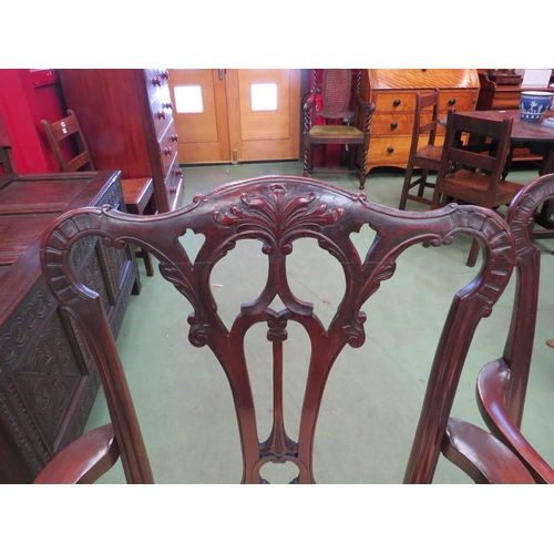 4115 - A pair of Georgian mahogany armchairs the carved and pierced backrest with acanthus leaf outswept ar... 