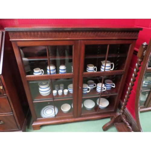 4125 - A Victorian walnut pier cabinet having height adjustable shelves, the two glazed doors with working ... 