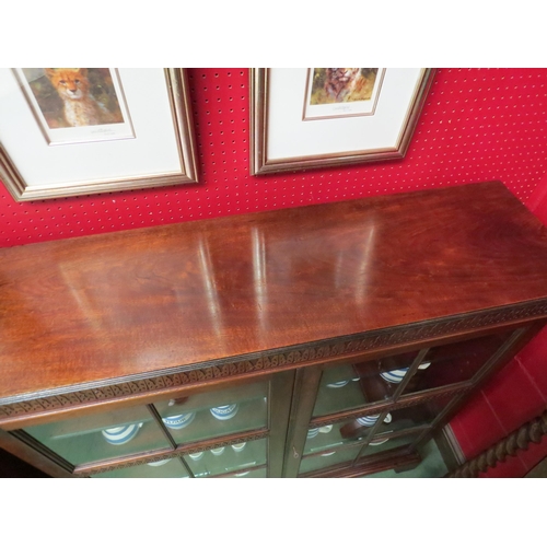 4125 - A Victorian walnut pier cabinet having height adjustable shelves, the two glazed doors with working ... 