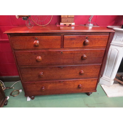 4150 - A mid Victorian walnut chest of two short over three graduating long drawers having bun handles over... 