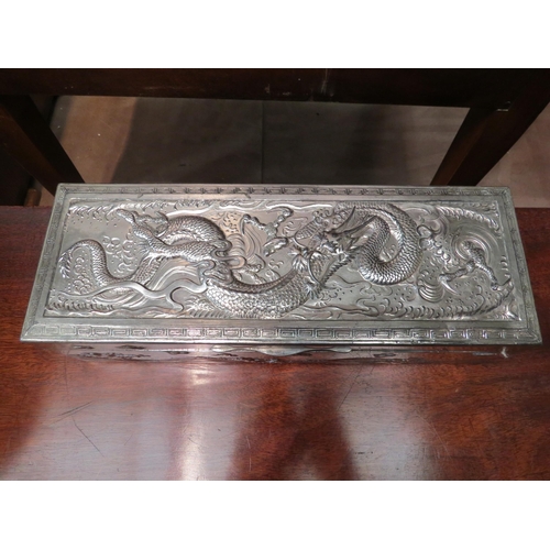 4198 - A Chinese white metal lidded box with dragon, birds and waves design, lid a/f, 8.5cm high x 29cm lon... 