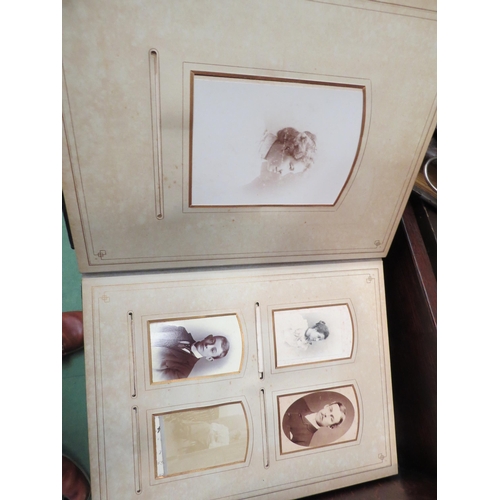 4201 - Three leather bound portrait albums and a selection of frames, some with portraits