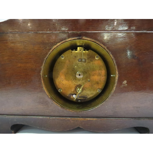 4272 - An early 20th Century mantel clock, brass face, black numerals, on a stepped base