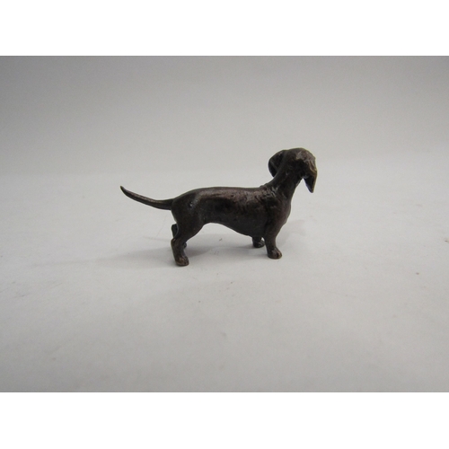 4315 - A miniature solid bronze Dachshund, 4cm long