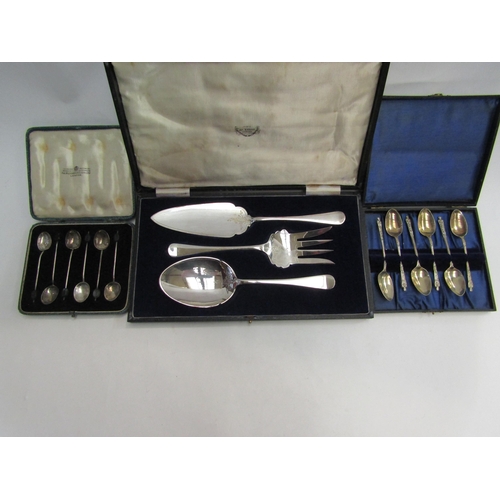 4440 - A set of silver coffee bean spoons, marked Birmingham, cased, together with a set of plated coffee s... 