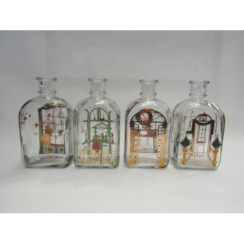 4441 - Four Holmegaard glass Christmas design bottles and a glass oil lamp