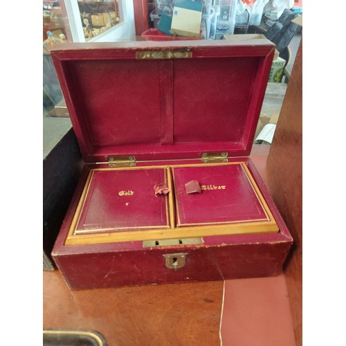 4207 - Two leather jewellery boxes, one with internal compartments for gold and silver, the other with velv... 